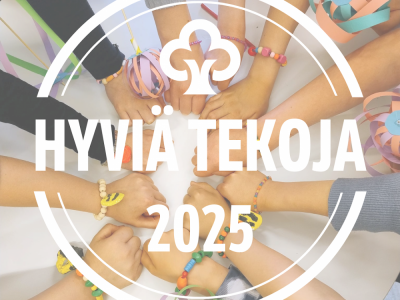 Hyvä tekoja -kampanjakuva ja taustalla lasten kädet piirissä